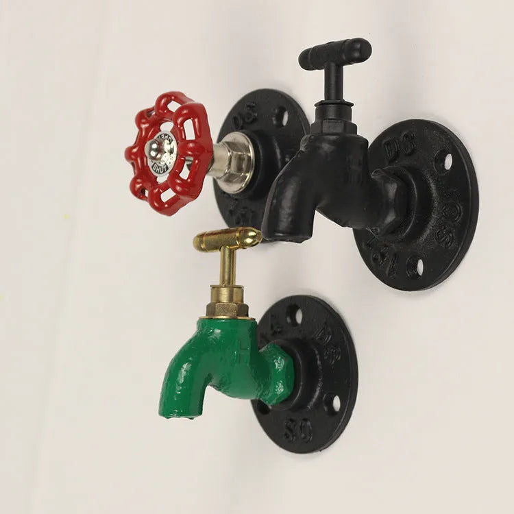 Water pipe style polished metal wall hook for hanging towels and clothes in a choice of three colours.