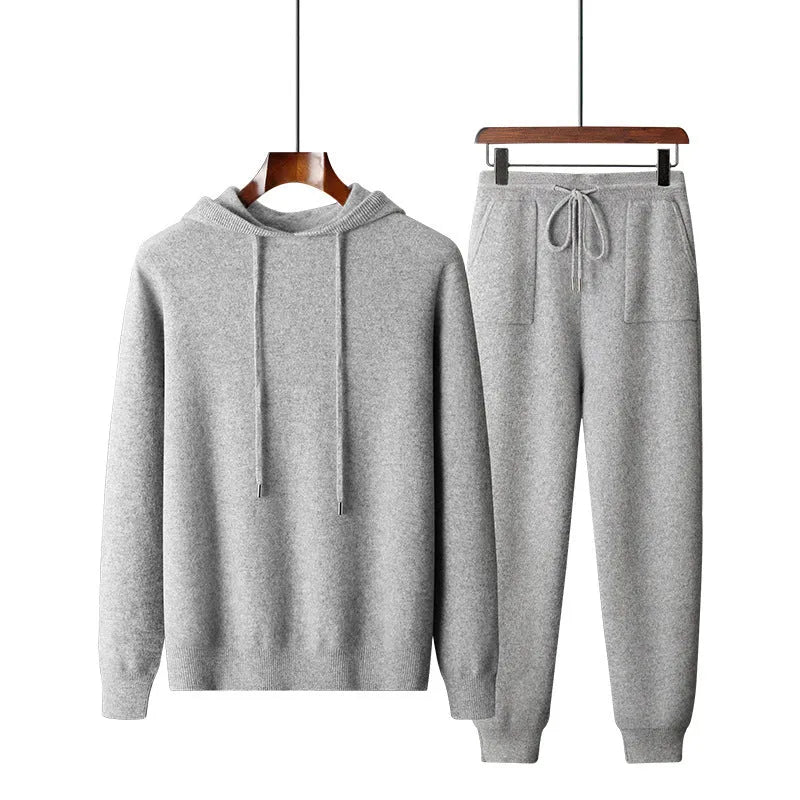 Men's light gray hooded cashmere sweatshirt and matching trousers laid flat as a set.