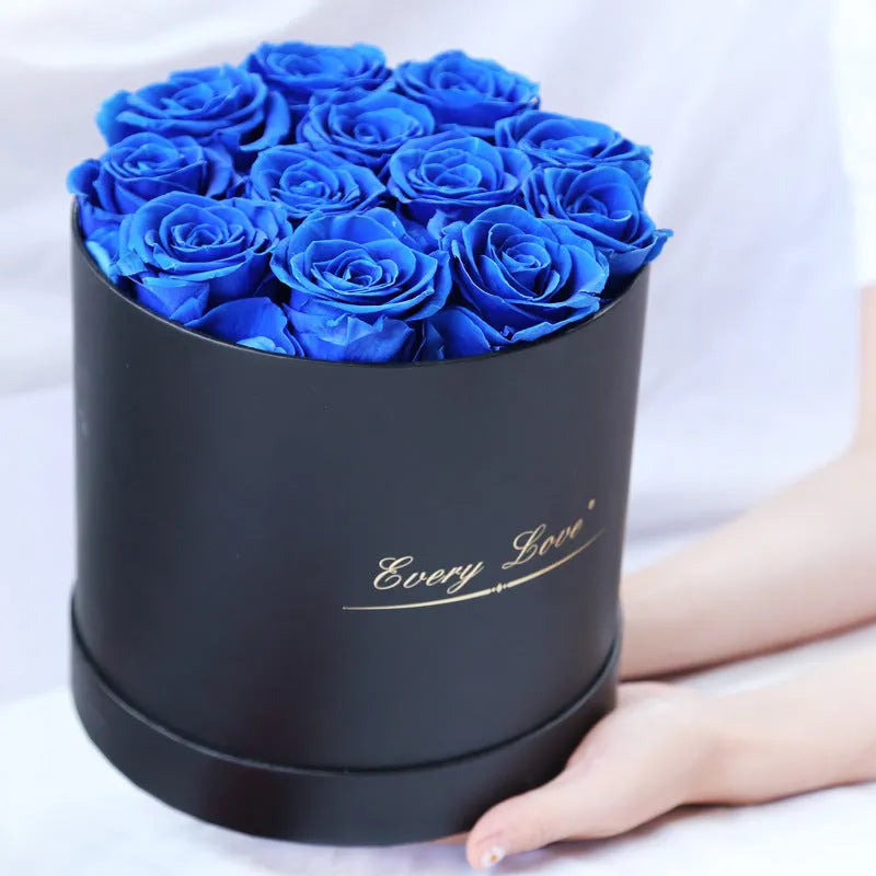 Handmade everlasting rose in hug bucket with preserved flower material, available in white red pink black blue colours
