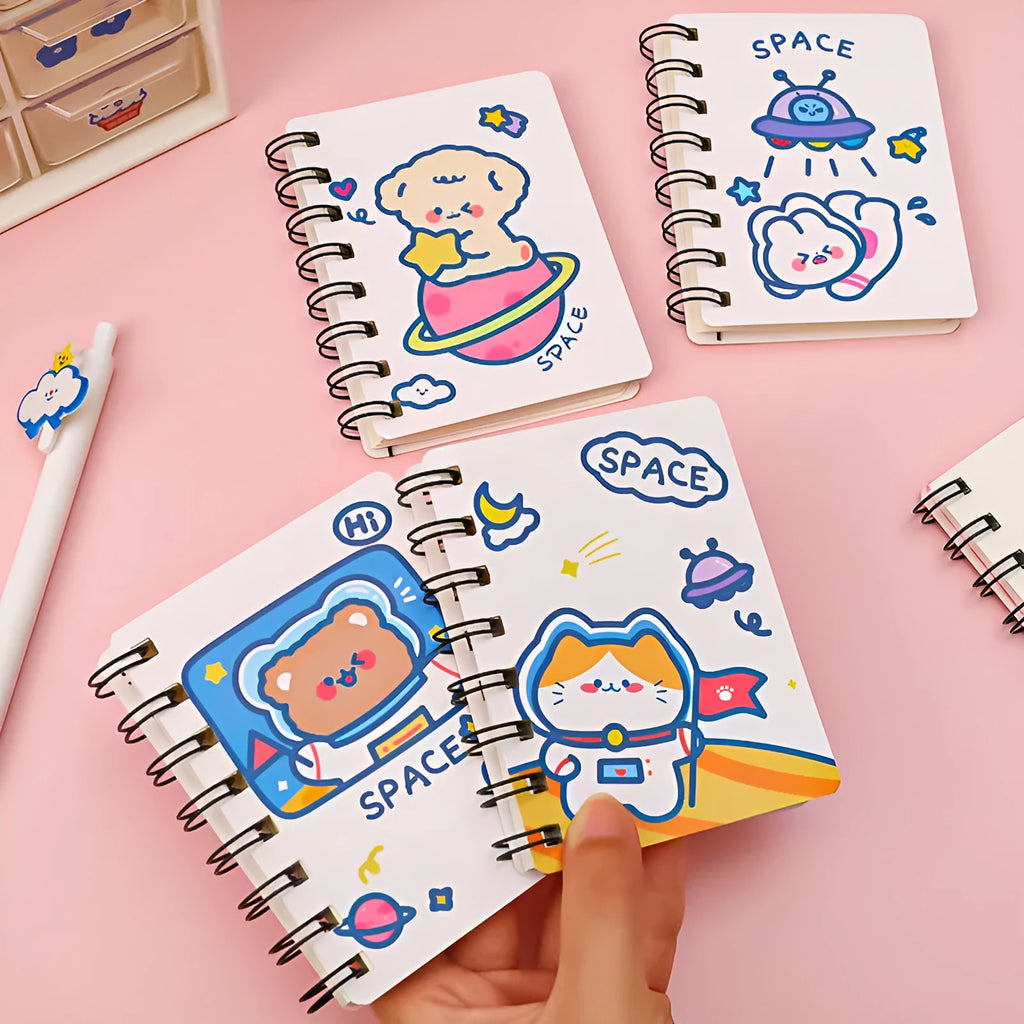 Astronaut flipped portable pocket notebook showing space-themed cover designs at 10.5 by 8 cm size