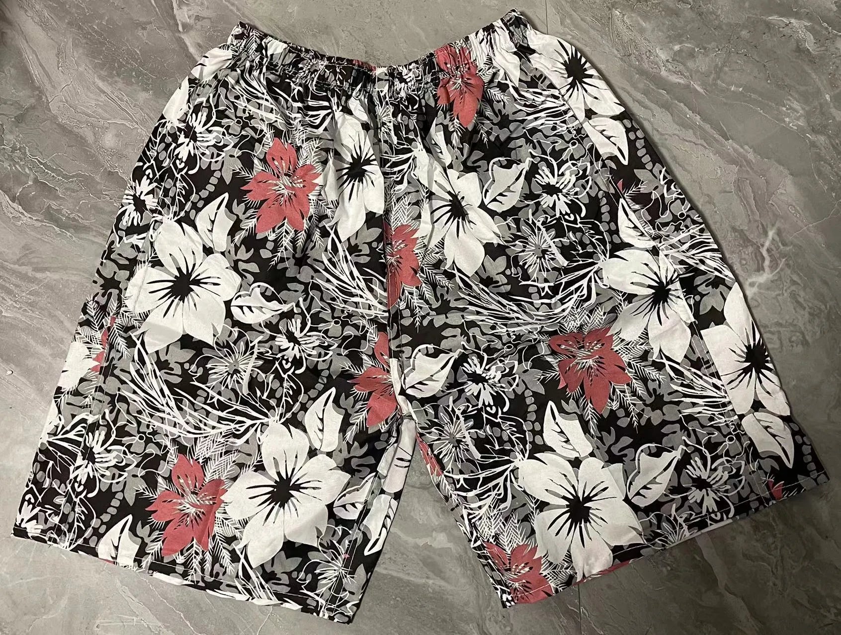 Men's floral print swimming trunks in polyester with five-point design