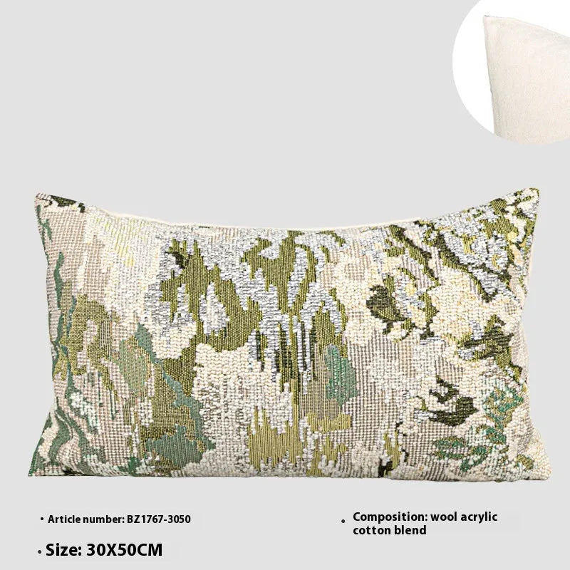 Antique green wool blend cushion with abstract spring flowers pattern, shown in square and lumbar sizes.