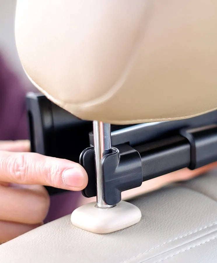 Black universal car phone holder mounted on a car rear seat base, holding a tablet for navigation