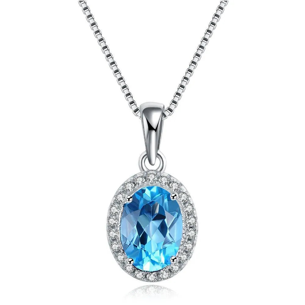 925 sterling silver jewellery set with blue topaz stones including geometric earrings, necklace, ring and pendant