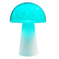 Mushroom-shaped remote control night light with RGB colour changing on wooden surface