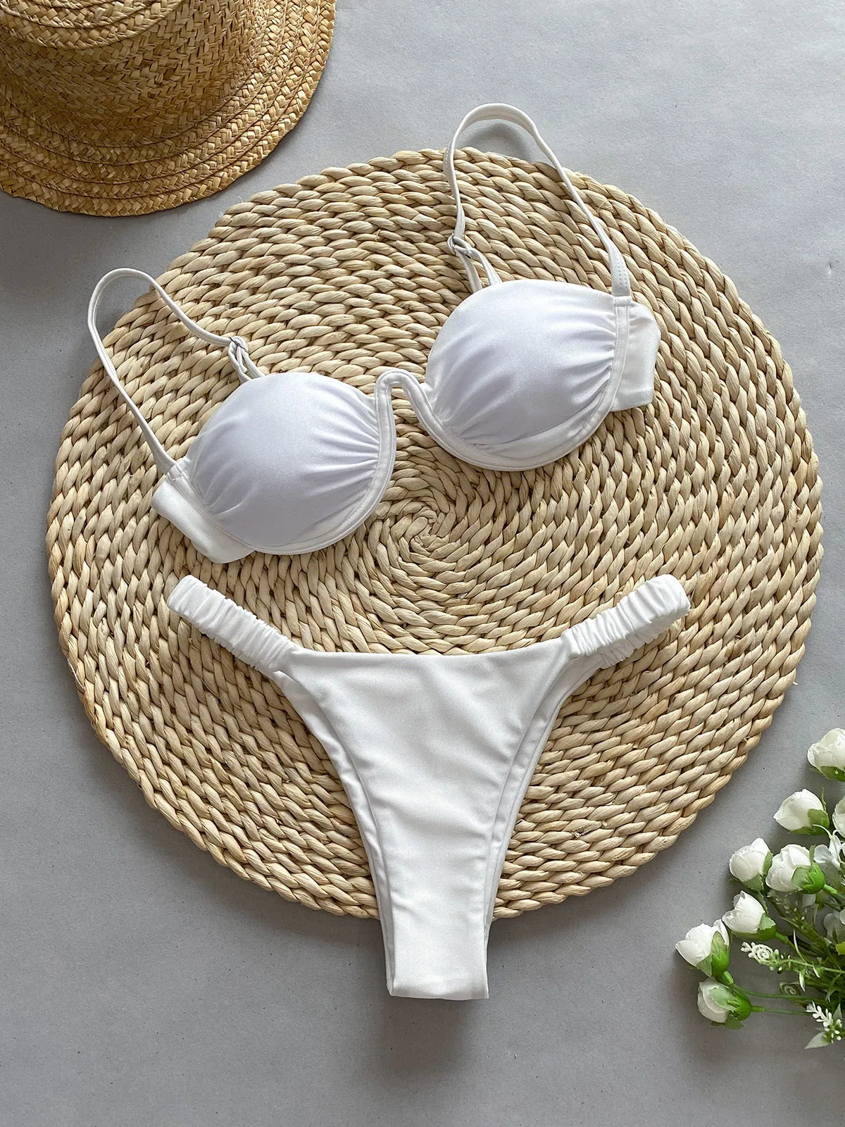 Women's black underwire bikini set with briefs style on a mannequin.