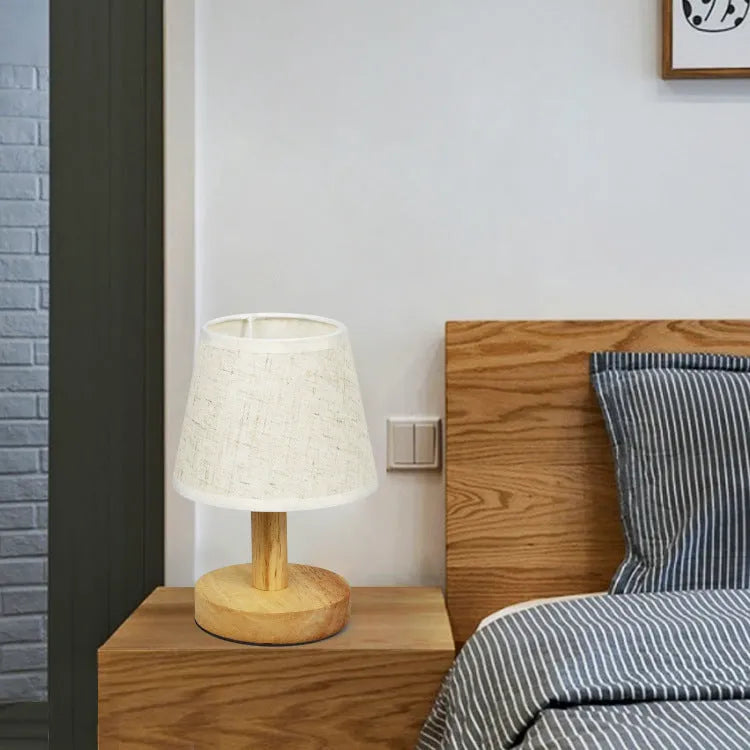 Vintage pleated table lamp with jute and linen shade on bamboo base, featuring USB charging and three-colour dimming.