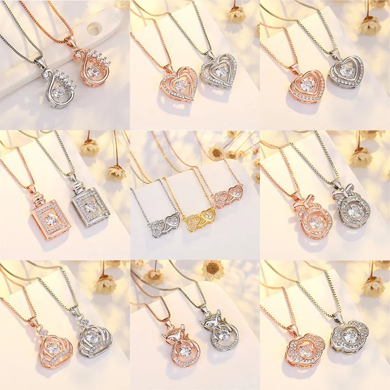 Women's silver heart-shaped pendant necklace with crown and bow decoration on a delicate chain.
