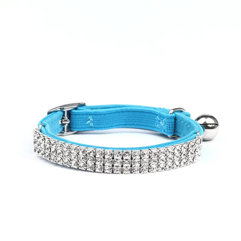Soft red velvet cat collar with rhinestones, shown adjusted to fit.