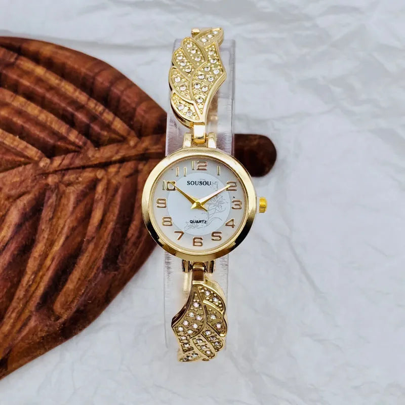 Women's stainless steel watch with round dial and Vachette clasp, shown in gold colour option.