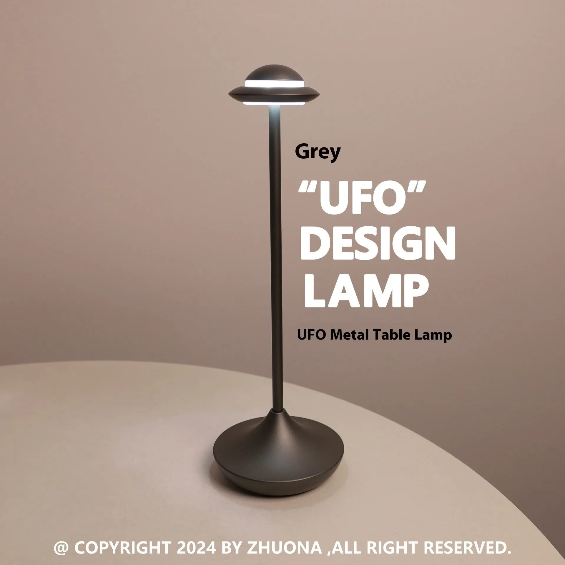Creative metal UFO table lamp in black with touch dimming on a wooden desk.