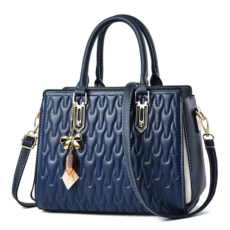 Women's messenger shoulder bag in gold colour showing outer pocket sandwich design and organised interior compartments