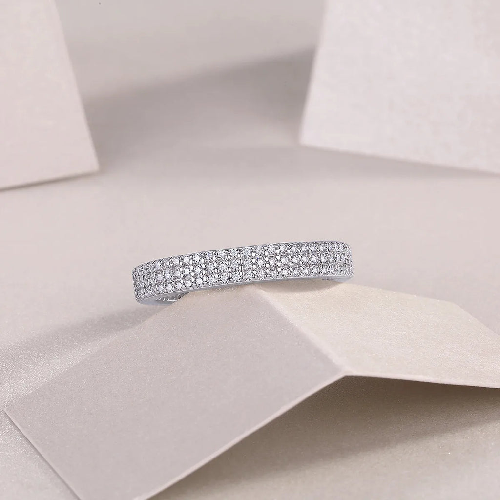 Moissanite wedding ring set in S925 silver with platinum plating, yellow gold colour, on white background
