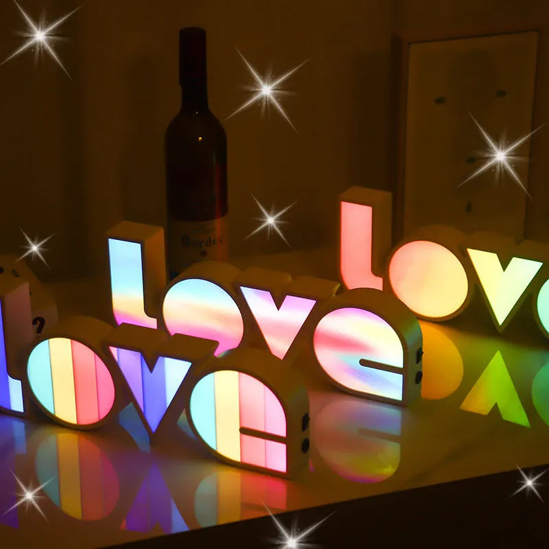 Colourful LED love light decorative lamp with plastic shell on a table