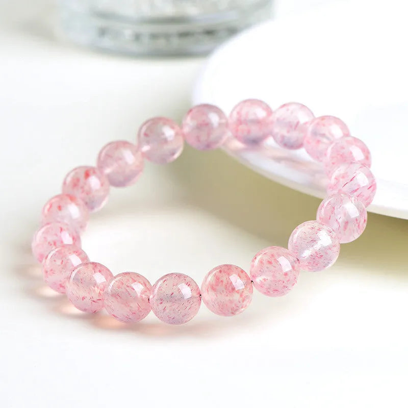 Strawberry quartz crystal bracelet with round 10mm beads on stretch cord