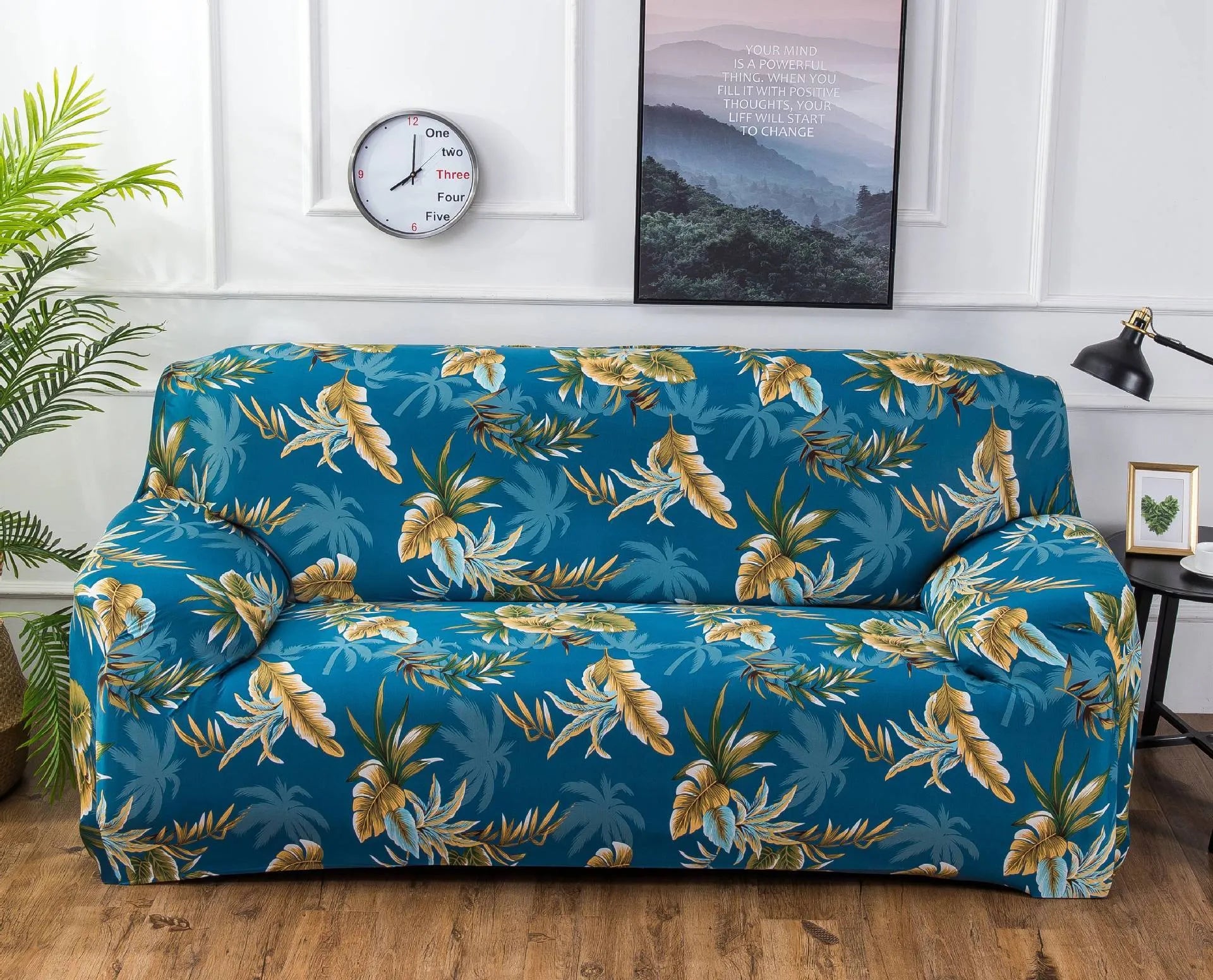 Geometric patterned stretch sofa slipcover fitted on a modern two-seater sofa.