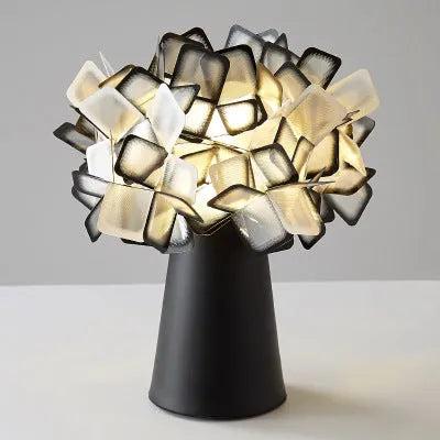 Nordic style bedside table lamp with metal holder in black, showing warm, white, and neutral light settings.