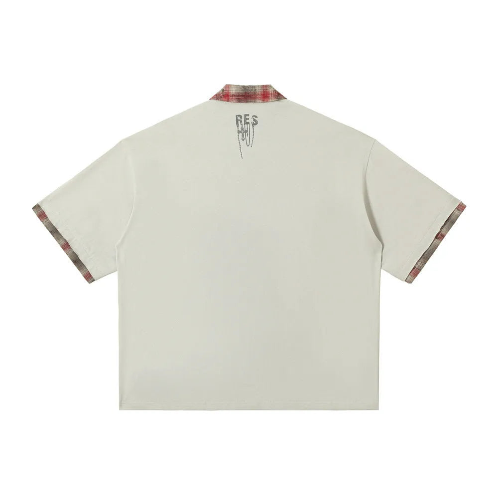 Men's loose blue cotton top with a short sleeve and an asymmetric lapel featuring a graffiti print.