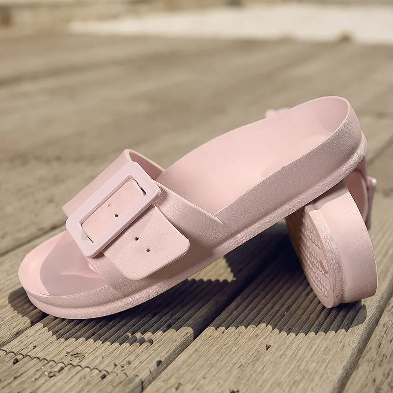 Women's grey blue flip-flop slippers with a buckle strap and soft EVA sole.