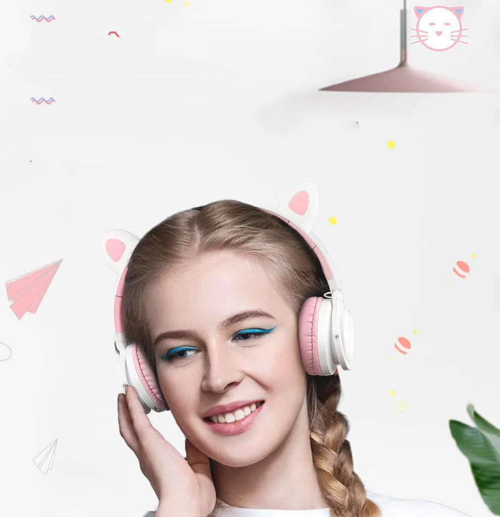 Pink white Luminous over-ear Bluetooth headset with braided wire and large ear cushions.