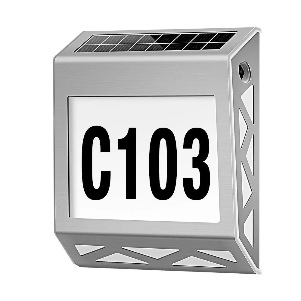 Solar powered doorplate light with LED indicator in black or silver finish, measuring 180x50x200mm