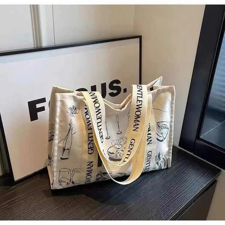 Large canvas tote bag with printed design, shown in multiple colour and pattern options.