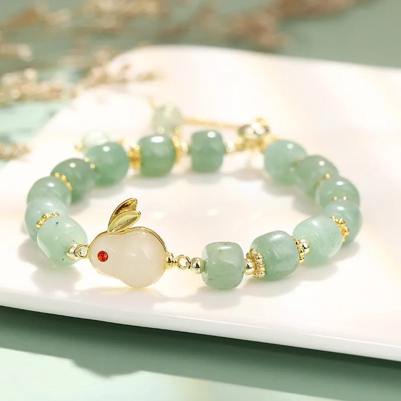 Rabbit charm bracelet with green aventurine or strawberry quartz stones on gold-plated copper