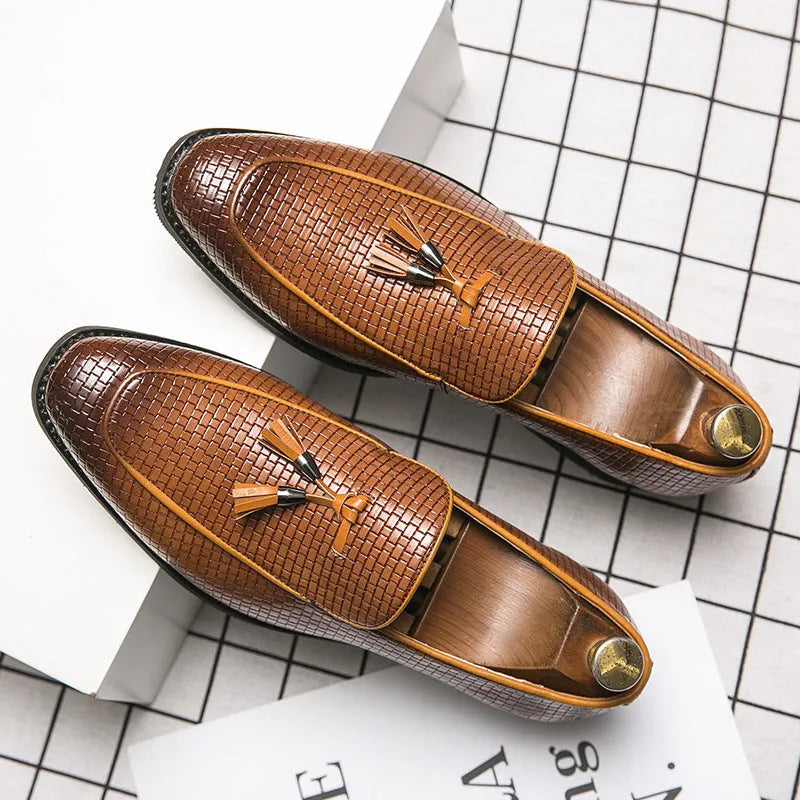 Men's black pointed toe slip-on business shoes with decorative tassel on artificial PU upper