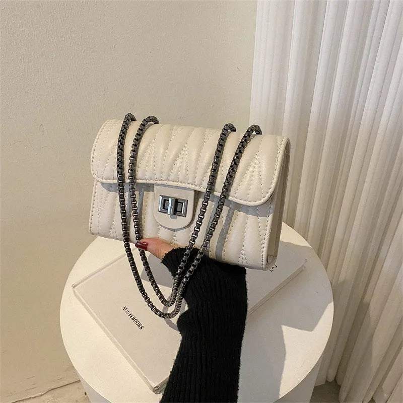 Retro textured diamond pattern small PU leather bag in a horizontal square shape, shown in beige colour.