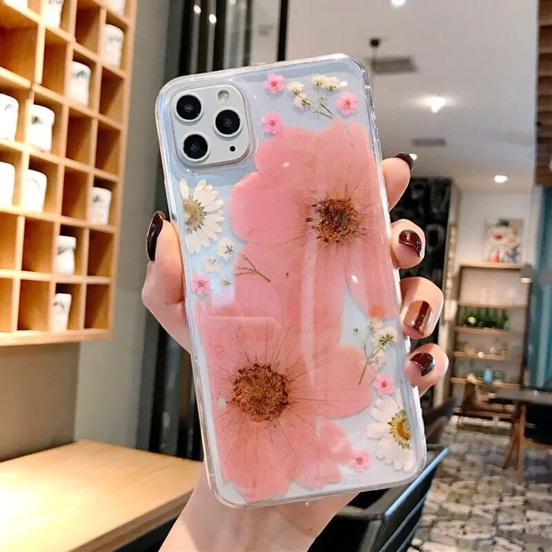 iPhone phone case with a large pink floral design on a flexible TPU back cover.