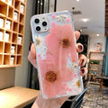 iPhone phone case with a large pink floral design on a flexible TPU back cover.