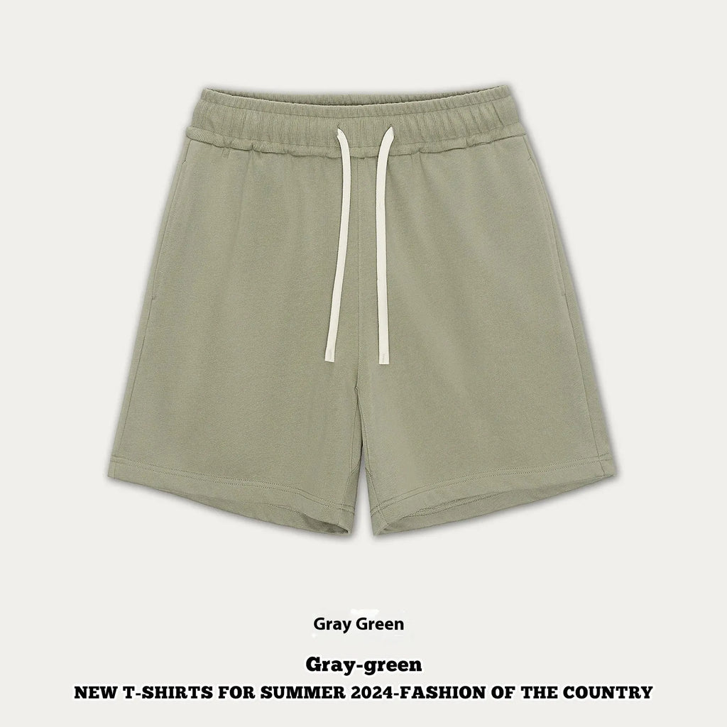 Baby boy and girl wearing loose-fitting cotton denim shorts in cream apricot colour.