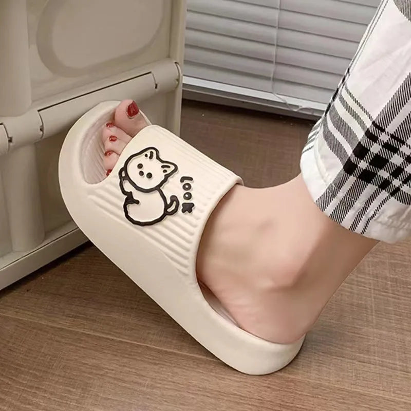 Women's green cat slippers with thick EVA platform sole, shown from above.