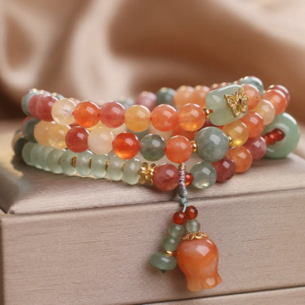 Natural Jinsi Jade multi-circle bracelet with round beads and lily pendant on display