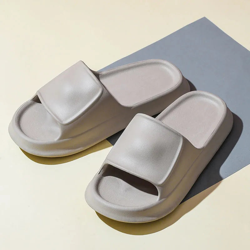 Soft EVA flip-flop slippers with thick sole in multiple colours on a white background.