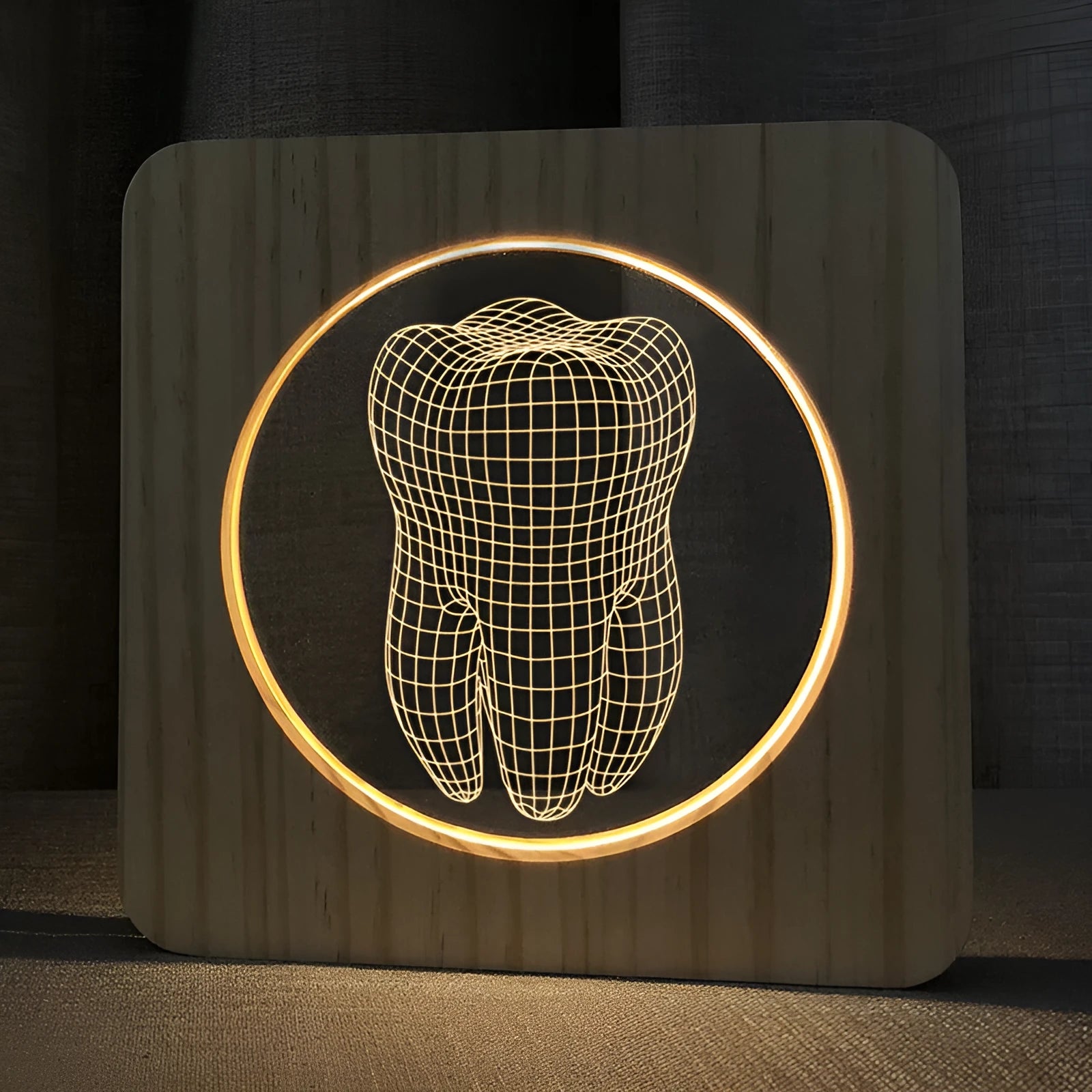 Wood colour tooth-shaped acrylic night light with USB cable on a table