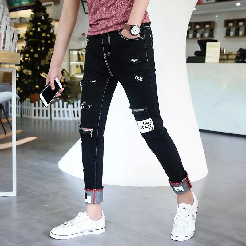 Men's autumn black ripped ankle jeans with micro elastic denim, youth-style tapered fit