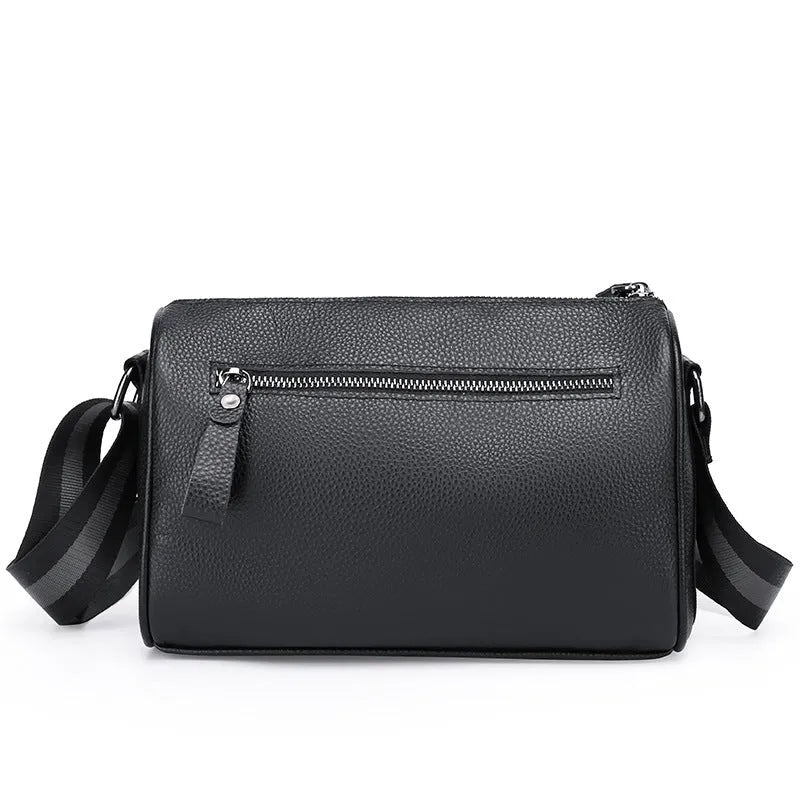 Black genuine leather crossbody shoulder bag showing 24cm height with polyester lining