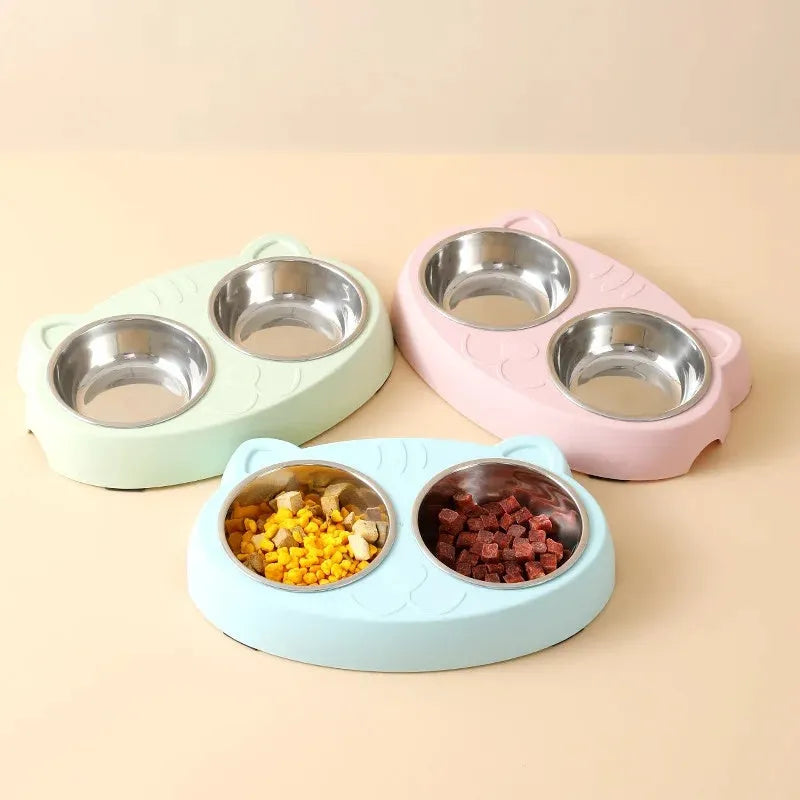 Blue plastic dual-bowl pet feeder tray for cat food and water on a white background.
