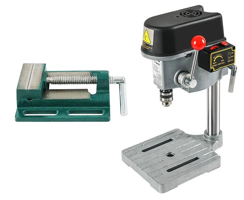Mini bench drill milling machine with AC power supply and included bench pliers on workbench