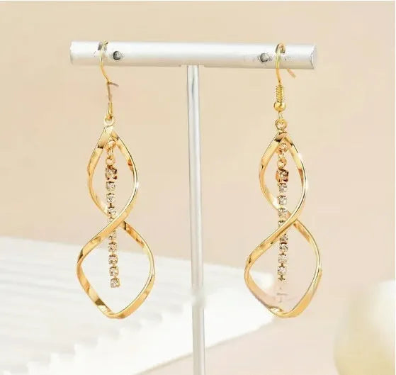 Geometric spiral design gold electroplated alloy earrings for women with ellipse decorative elements