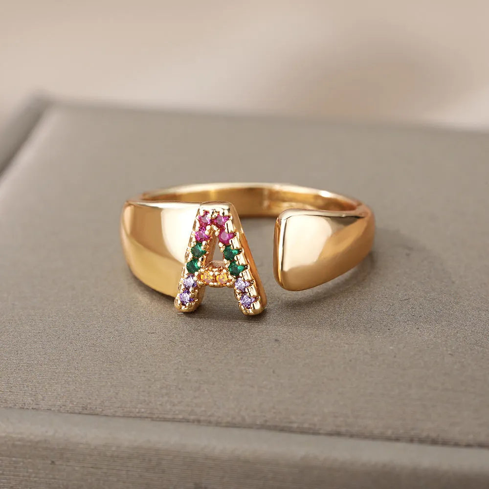 Fashion micro-set colored zirconium adjustable open ring showing letter A on a copper electroplated base