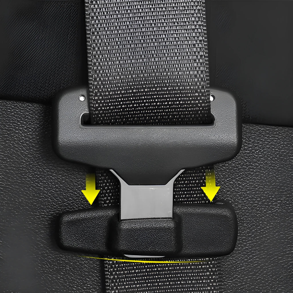 Two black ABS plastic car seat belt stopper clips on vehicle seat