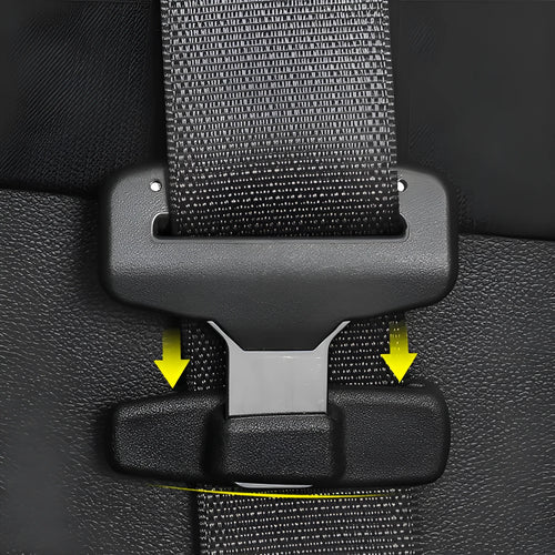Two black ABS plastic car seat belt stopper clips on vehicle seat