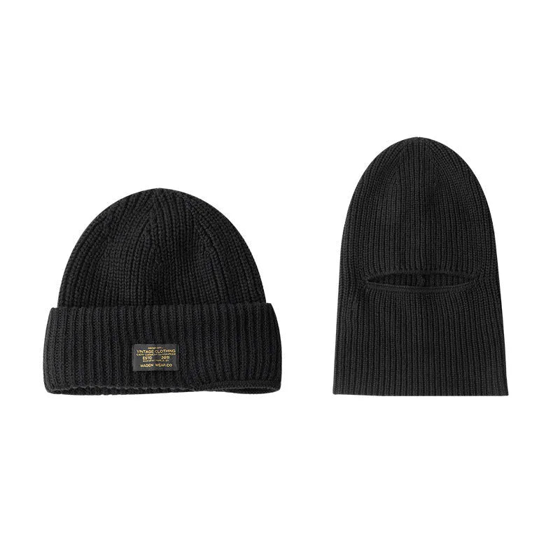 Vintage knitted melon skin warm beanie in black with patch detail on a plain background