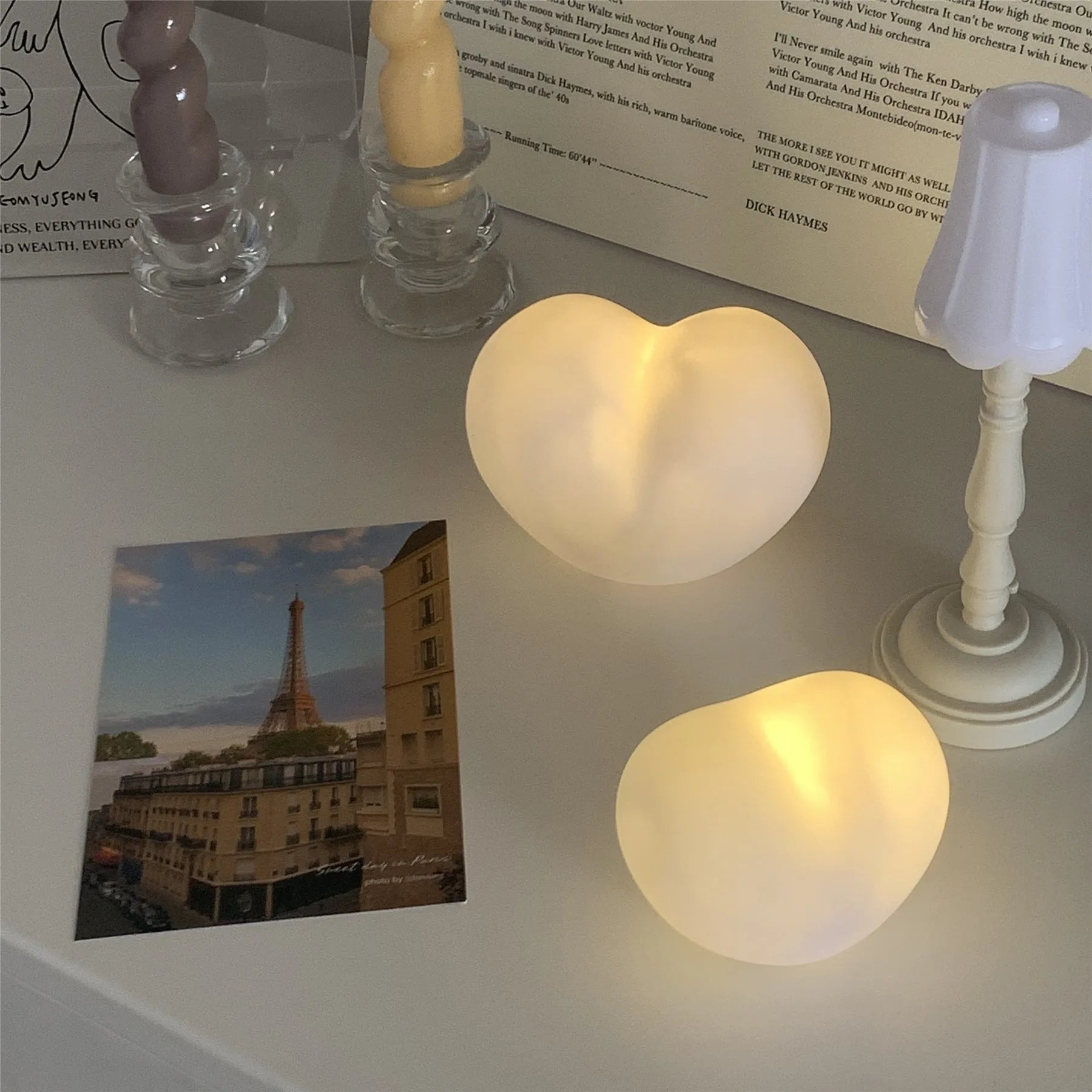 White and pink vinyl atmosphere lamps glowing warmly, shown in small and large size options.