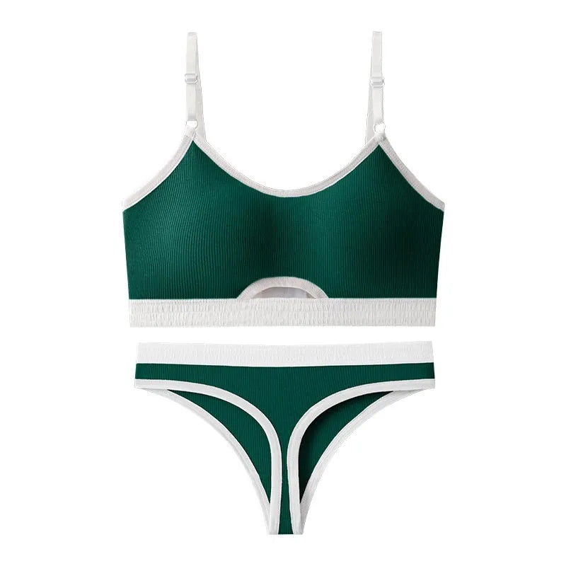 Women's contrast back sports bra vest and briefs set in black with underwire and padding.