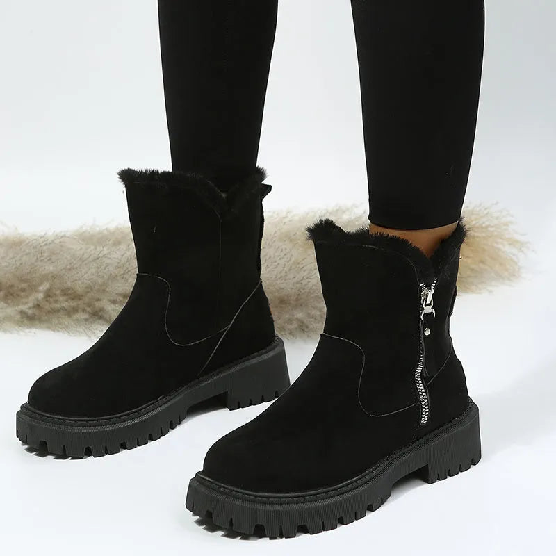 Women's black high-top snow boots with a side zipper and faux suede upper on a rubber sole.