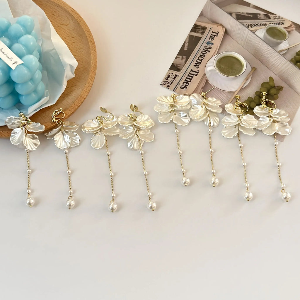 Women's acrylic earrings with pearl and shell tassel design measuring 8.8cm length