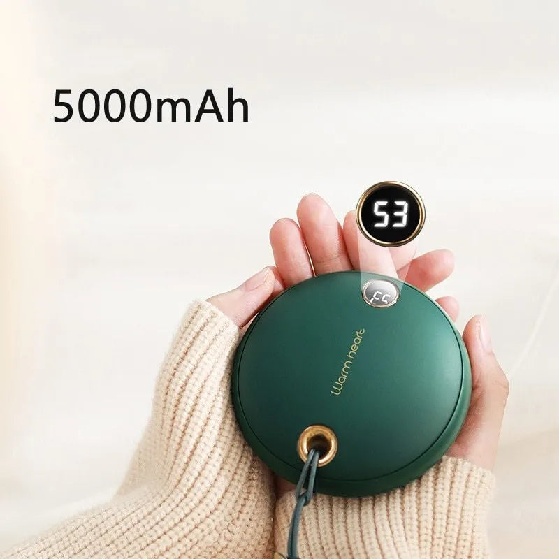 Green hand warmer power bank with digital display showing battery percentage and temperature setting